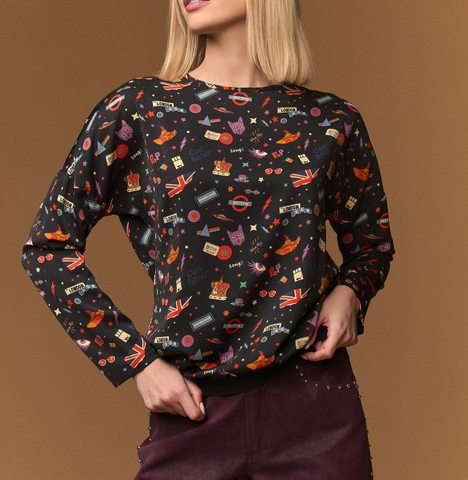 Top Picadilly de Minueto negro con estampado multicolor, manga larga y cuello redondo